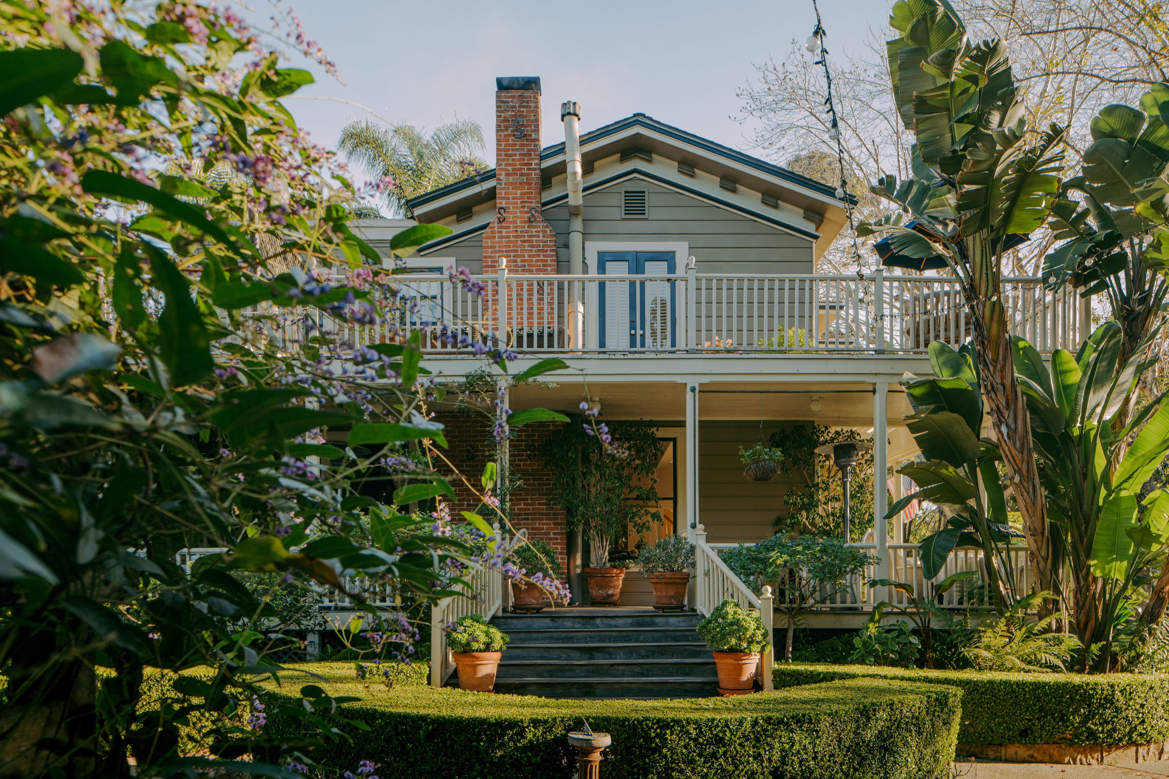 The garden facade and wraparound veranda of the Simpson House Inn in Santa Barbara